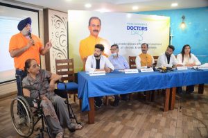 Guru Manish (centre on table), the founder of Shuddhi Ayurveda along with doctors held a press meet in which patients cured by Ayurveda also participated on occasion of doctors' day. (1)