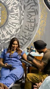 Tattoo Artist, Pardeep Singh making a tattoo for playback singer, actress and songwriter, Afsana Khan.