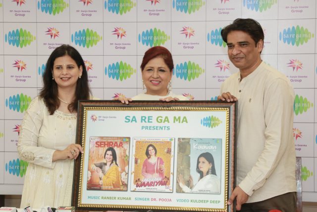 Punjabi Singer, Dr. Pooja flanked by Savita Bhatti and Ranbir Kumar unveil a poster of Punjabi Traditional songs during the Press Meet held at Press Club, Chandigarh on 15 April, 2022..