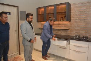 Kirit Joshi, Founder & Director of Spacewood showcasing a modular kitchen set up at the unveiling of Spacewood's first store in tricity at Sector 82, Mohali.