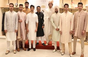 Sandeep Pal, CEO, TASVA standing in black dress (Centre)along with the models at the unveiling of TASVA, in Chandigarh.