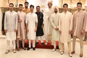 Sandeep Pal, CEO, TASVA standing in black dress (Centre)along with the models at the unveiling of TASVA, in Chandigarh.