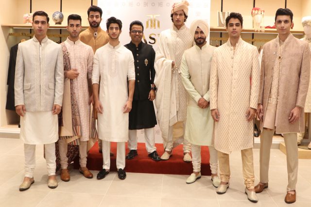 Sandeep Pal, CEO, TASVA standing in black dress (Centre)along with the models at the unveiling of TASVA, in Chandigarh.