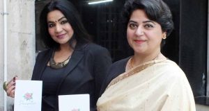 Dr. Suneet Madan (Right) poses with her book 'Poinsettia' at its launch event. Also seen is Nisha Luthra, Founder, The Narrators. The event was held at Tagore Theatre's mini auditorium