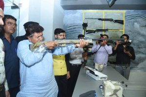 Gian Chand Gupta, Speaker, Haryana Vidhan Sabha taking a shot at the shooting range at 'Funville' -The Joy Land, after inaugurating the unique gaming zone at Bella Vista Mall, Panchkula 22G TV