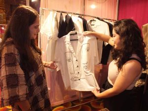 An exhibitor showcasing an androgynous- gender neutral attire to a customer at the 2 day luxury lifestyle exhibition 'The Indian Bride' at Hotel JW Marriott, Sector 35, Chandigarh on Saturday.