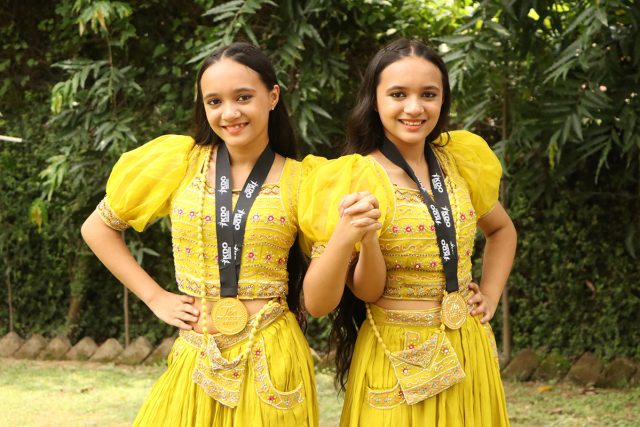 (L-R) Tanisha and Tanya pose with their gold medals won at the 'World Dance Festival' held in S. Korea recently.