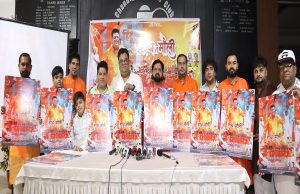 Raman Dewan (6th from left) singer of 'Haath Mein Mauli' alongwith members of the cast of the song's video and others, unveiling the poster of the song at its launch in Chandigarh Press Club.