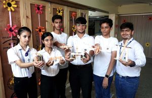 Students showing 'catapults' they prepared at a science event held as part of the 'Annual Vivek Fiesta '24'